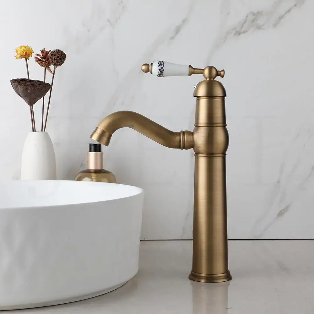 Decorbites antique brass swivel bathroom faucet mixer tap with single handle and white ceramic handle with black detailing
