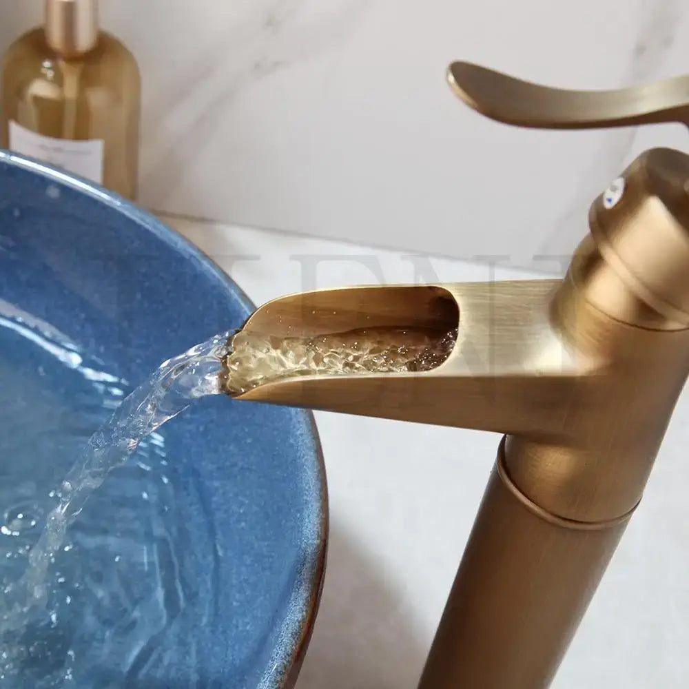 Decorbites™ antique brass swivel bathroom faucet mixer tap with single handle in sleek polished brass waterfall design