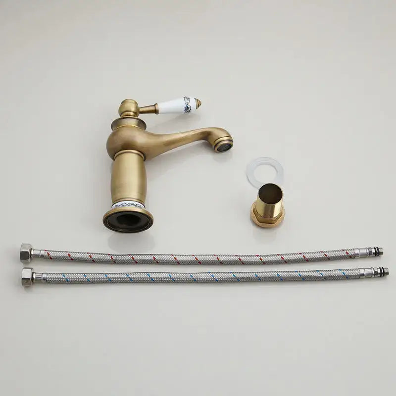 Decorbites™ antique brass swivel bathroom faucet mixer tap with single handle and white ceramic blue floral detailing