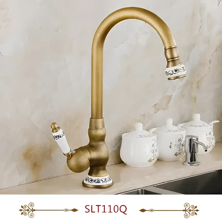 Decorbites antique brass swivel spout kitchen faucet with gold-toned curved spout and decorative porcelain accents