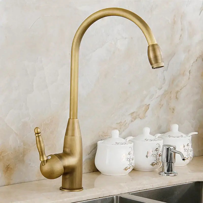 Decorbites antique brass swivel spout kitchen faucet with brass finish curved spout and ornate single handle