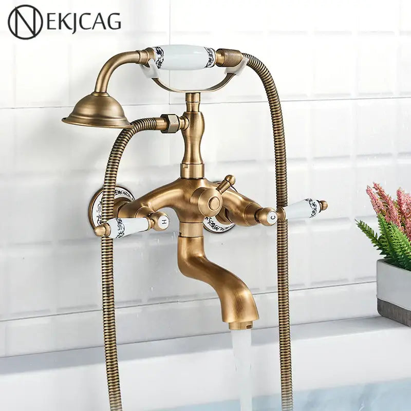 DecorBites™ antique brass telephone shape wall mounted bathtub faucet with white ceramic handles and braided hoses
