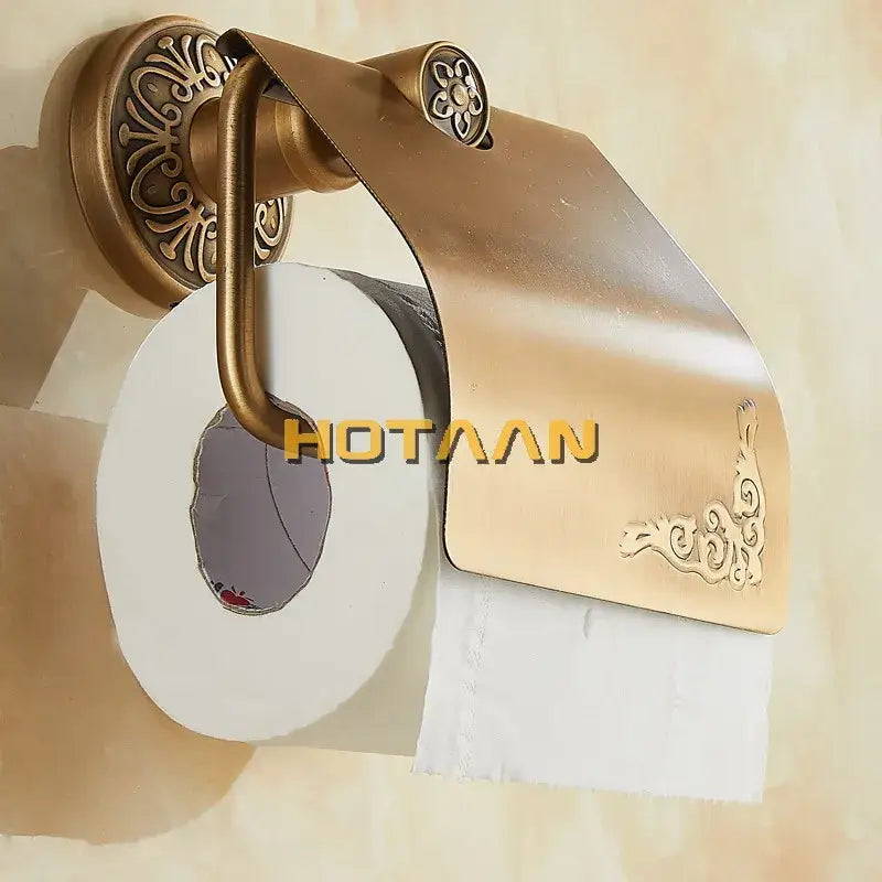 DecorBites™ antique brass toilet paper holder with ornate floral and scrollwork detailing for classic bathroom use