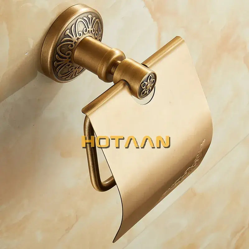 Antique brass toilet paper holder by decorbites with ornate scrollwork and sleek curved cover for bathroom use