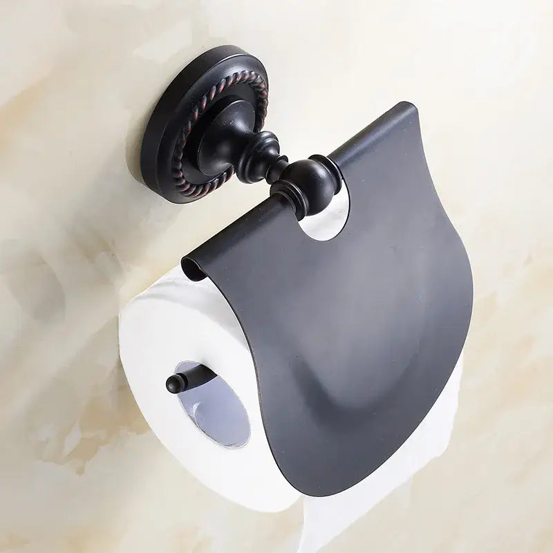 DecorBites antique brass toilet paper holder with black matte metal finish and rope-textured wall mount cover