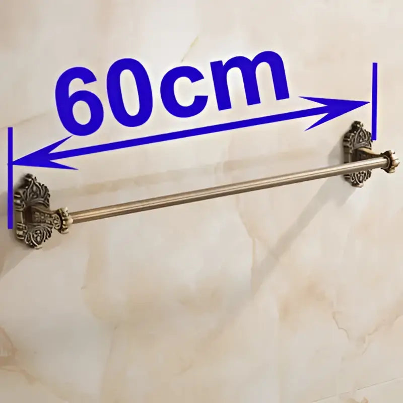 DecorBites antique brass towel bar featuring a double-ended design with ornate floral brass end caps