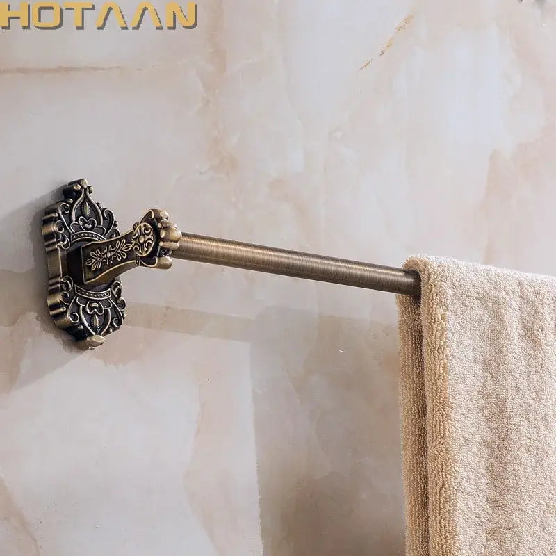 DecorBites™ antique brass towel bar with ornate scrollwork wall-mounted bracket for bathroom accessories