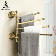 Decorbites antique brass towel rack with four horizontal bars and ornate circular bases for bathroom wall mounting