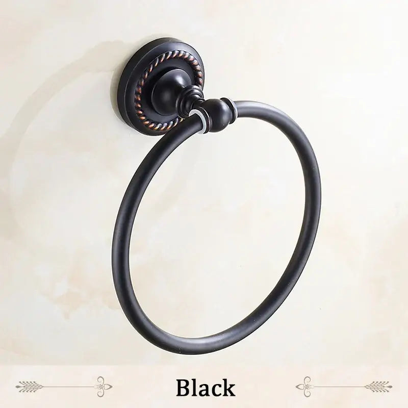 Decorbites antique brass towel ring with black matte metal finish and rope-textured circular base towel holder