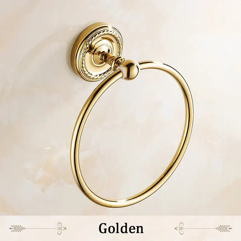 DecorBites antique brass towel ring with ornate twisted mounting plate and polished reflective finish bathroom towel holder