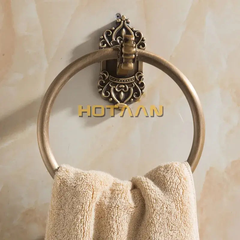 Decorbites antique brass towel ring with ornate scrollwork and central clasp wall-mounted brass towel ring for bathroom