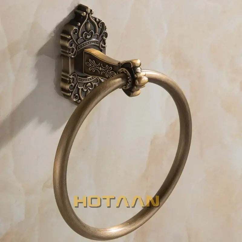 Decorbites antique brass towel ring with ornate crown-inspired wall mount and detailed floral engraving for bathroom use