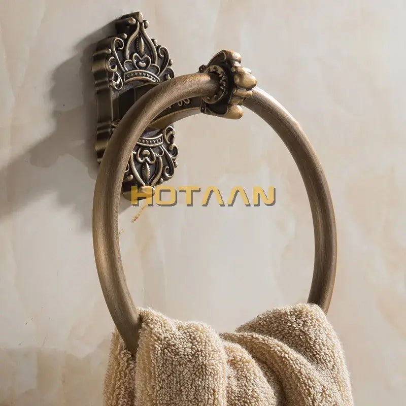 DecorBites antique brass towel ring with ornate crown wall mount and decorative scrollwork for bathroom use