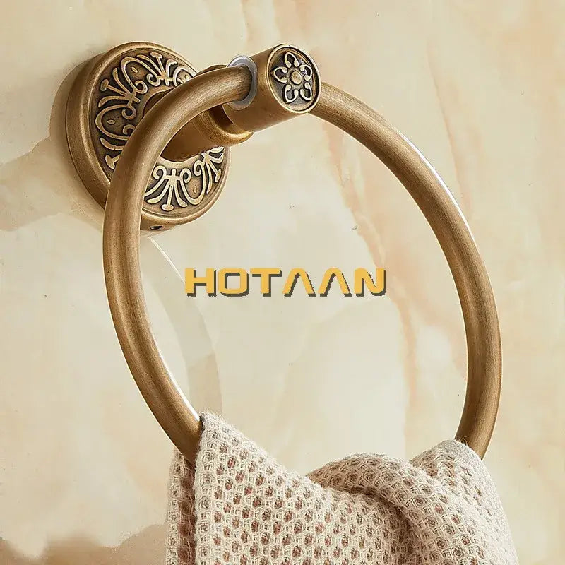 DecorBites antique brass towel ring with ornate floral and scrollwork detailing for wall-mounted bathroom use