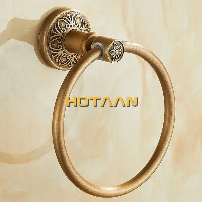 DecorBites antique brass towel ring with ornate floral mounting plate and round loop for bathroom wall mounting