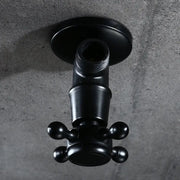 Black matte wall-mounted faucet with cross handle and knobs shown with decorbites antique brass triangle valve for toilet faucet