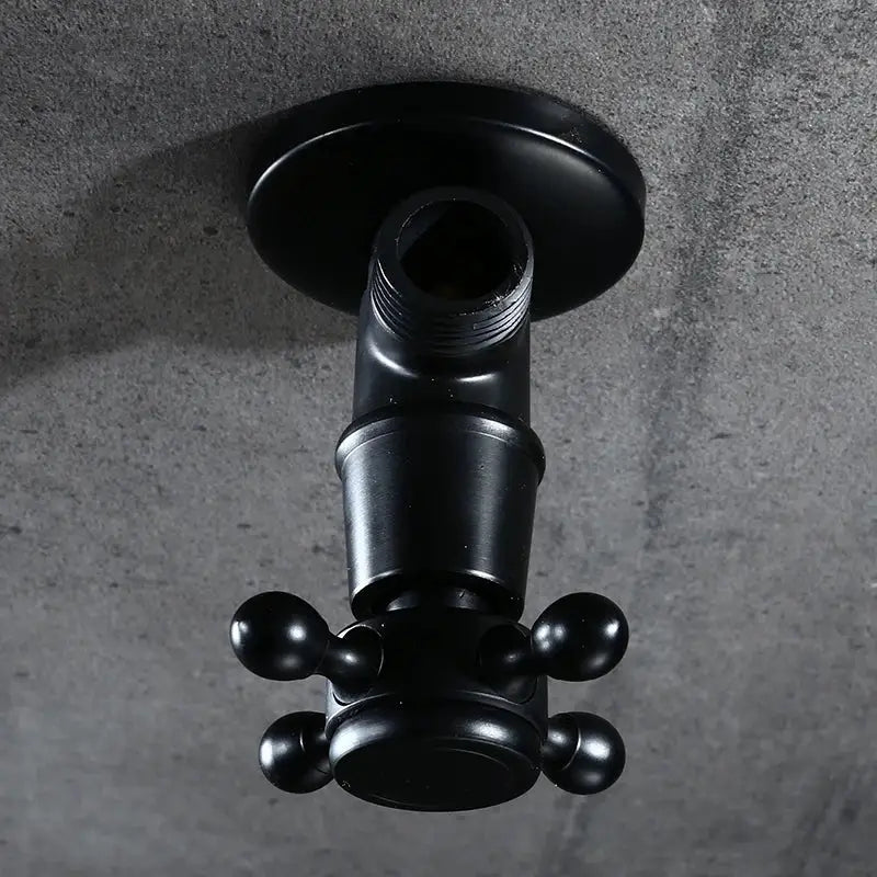 Black matte wall-mounted faucet with cross handle and knobs shown with decorbites antique brass triangle valve for toilet faucet