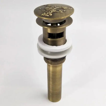 DecorBites antique brass vessel sink drain with floral engraved top and white ceramic washer for bathroom use