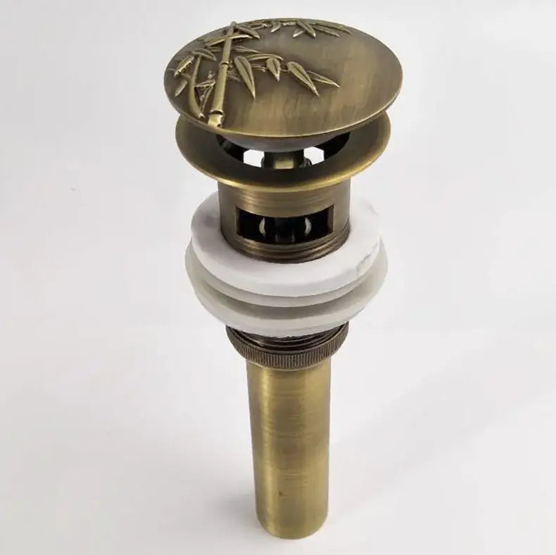 Antique brass vessel sink drain stopper with bamboo design and white ceramic sealing rings for bathroom use