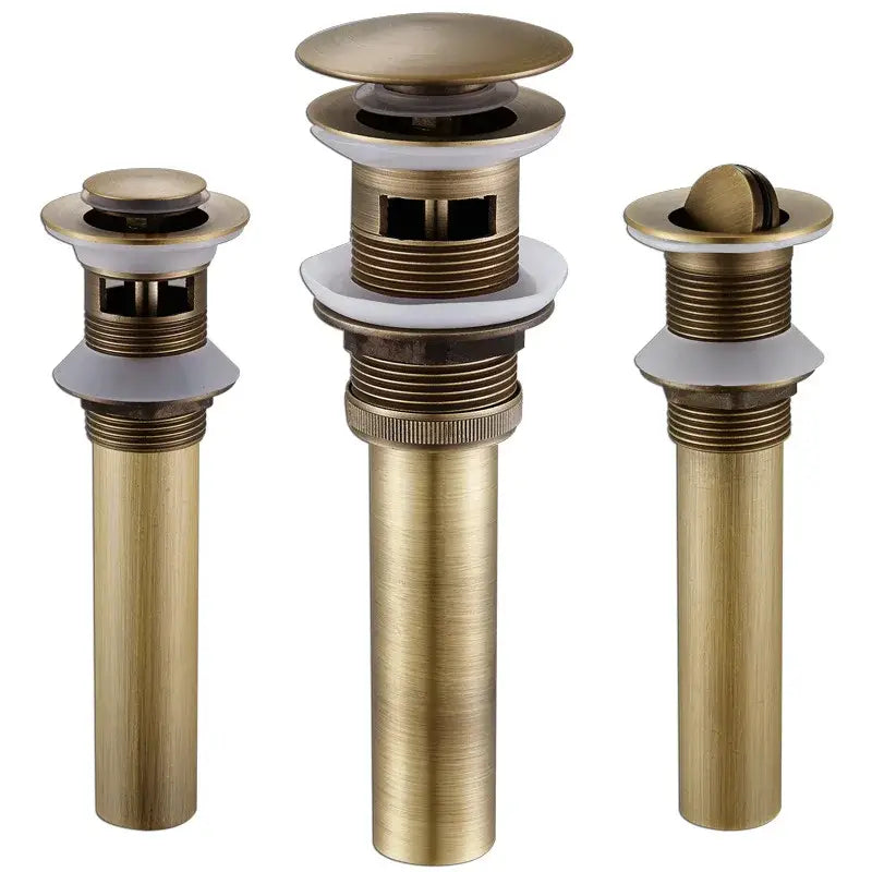 Three brass-finished antique brass vessel sink drain strainers with white ceramic seals for lavatory basin use