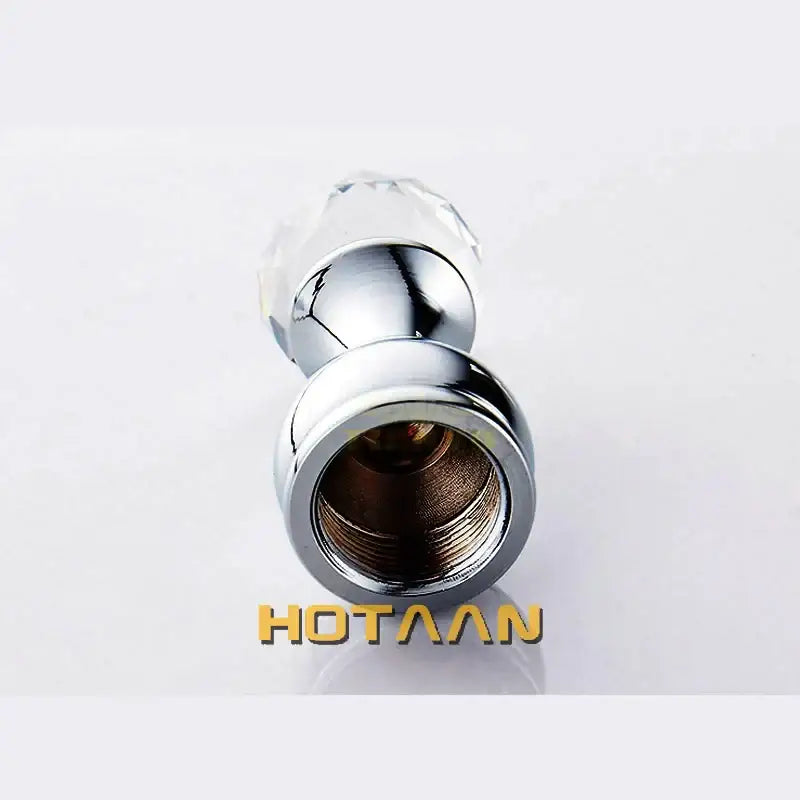 Chrome-finished bathroom faucet handle with faceted crystal knob paired with decorbites™ antique brass wall clothes rack