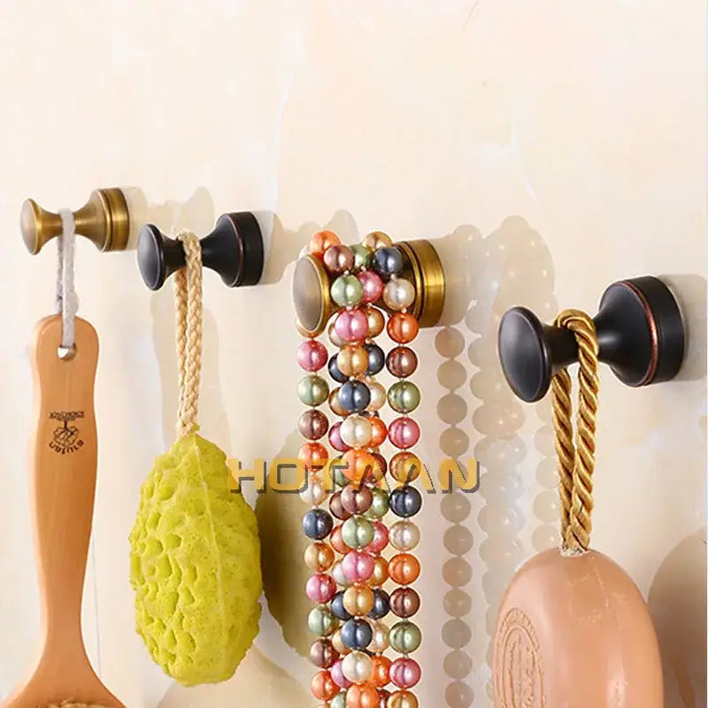 Set of four decorbites™ antique brass wall robe hanger hooks in brass wall clothes finishes for bath accessories