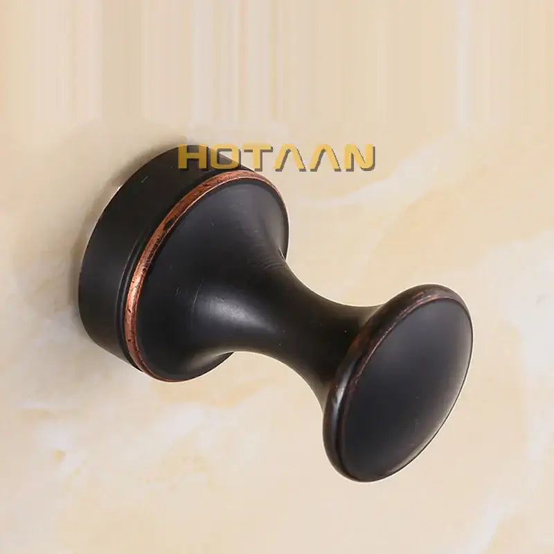 Decorbites™ antique brass wall clothes rack hook in black matte with copper accent ring for use as robe hanger
