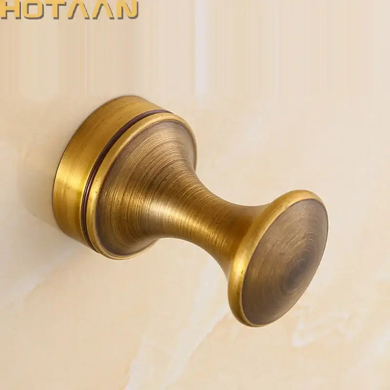 DecorBites™ antique brass wall robe hanger with vintage brushed metallic finish and rounded tapered design