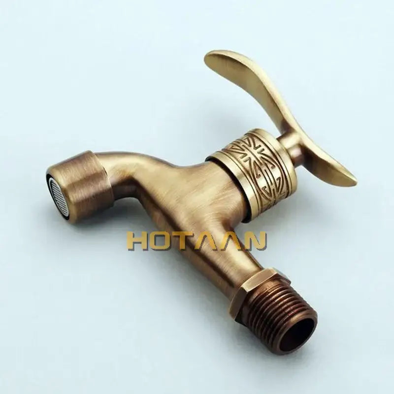DecorBites antique brass wall mount bathroom faucet with ornate engraved detailing on brass wall mount handle and spout
