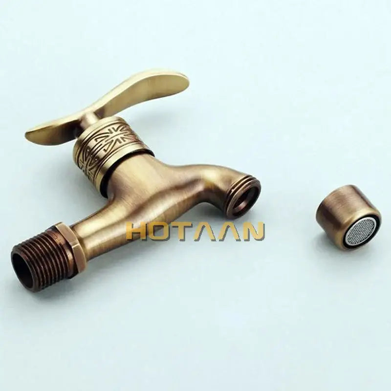 Decorbites™ antique brass wall mount bathroom faucet with ornate engraved handle and matching removable nozzle in brass wall mount design