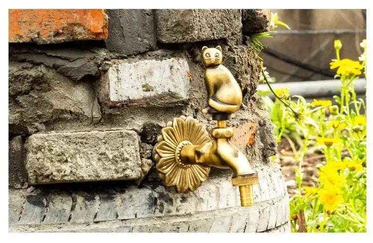 Decorbites antique brass wall mount garden faucet featuring a golden cat shape and sunflower design on brick wall