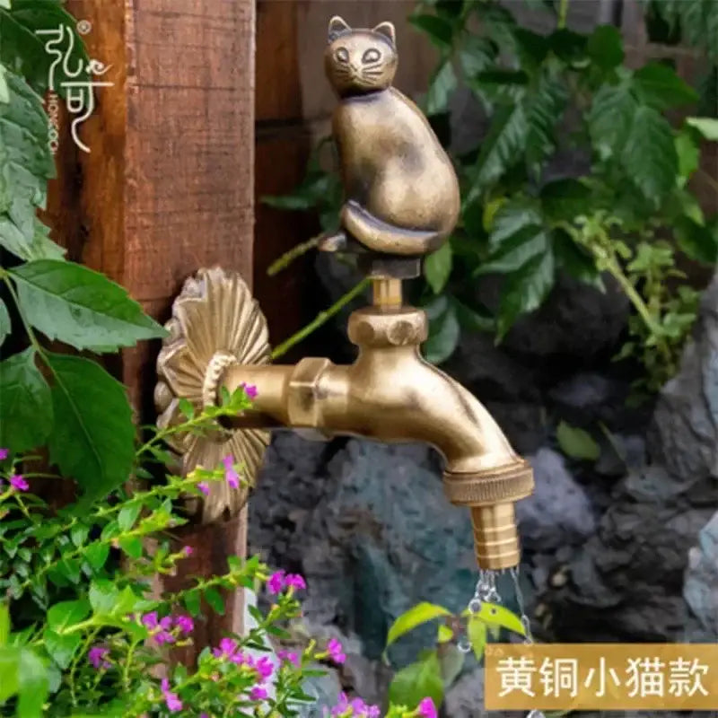 Decorbites™ antique brass wall mount garden faucet in brass with a brass cat design for kindergarden use