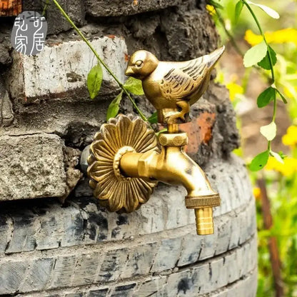 Decorbites antique brass wall mount garden faucet featuring a golden bird-themed brass outdoor spout with floral design