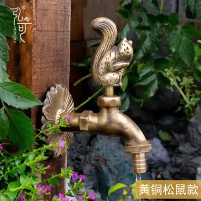 DecorBites™ antique brass wall mount garden faucet featuring a brass squirrel design with intricate leaf-shaped backplate
