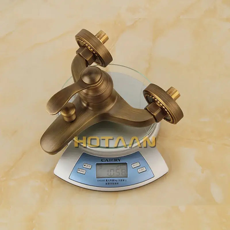 DecorBites antique brass wall mount shower head kit with classic faucet design and two handles for hot and cold water