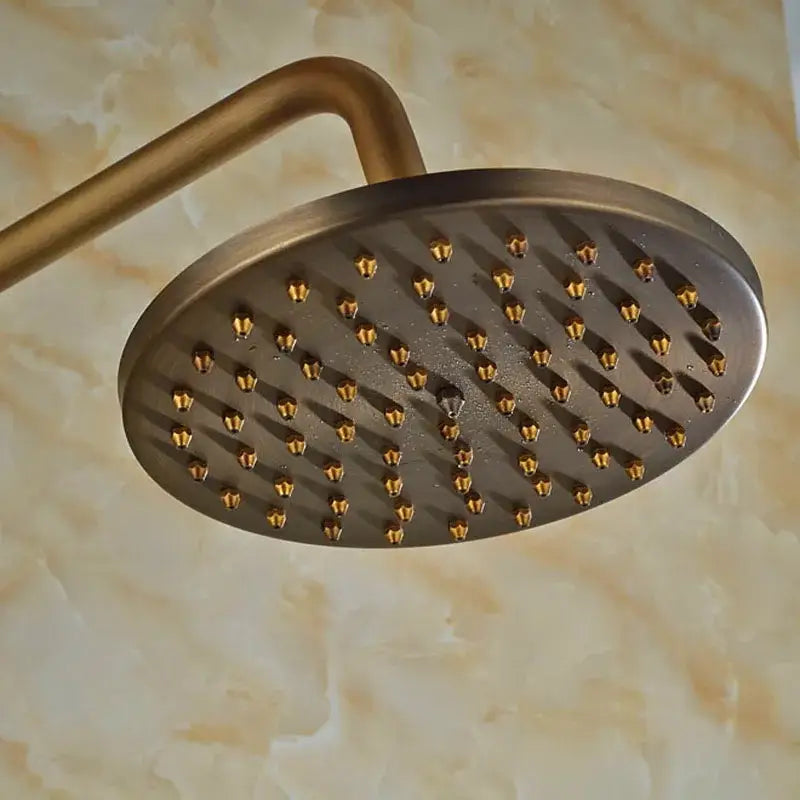Antique brass wall mount shower faucet with 8 inch antique brass round showerhead and golden nozzles in matte finish