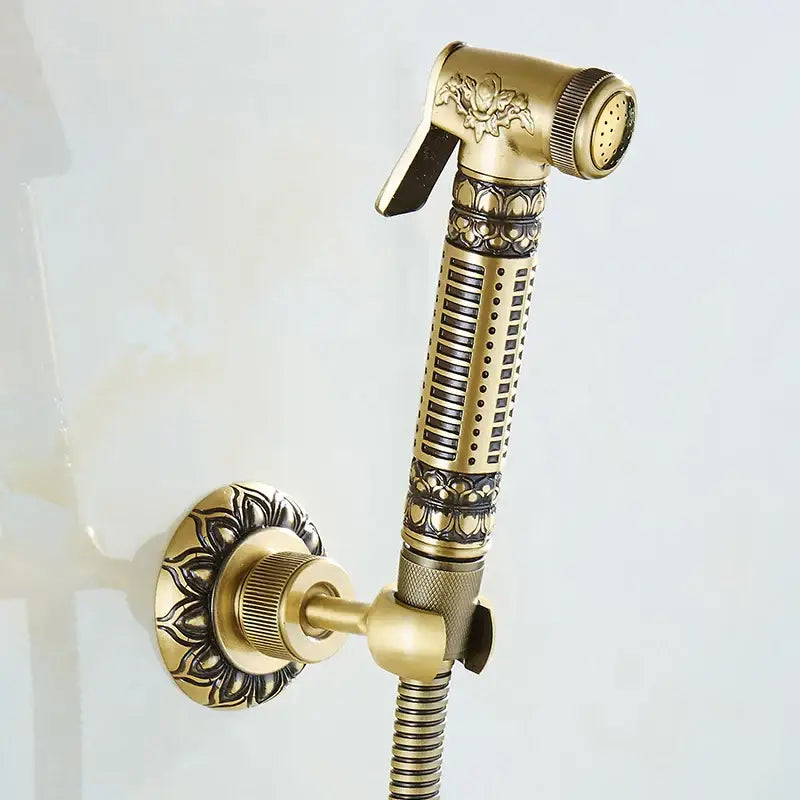 DecorBites antique brass wall mounted bidet faucet with ornate floral and geometric detailing for hygienic cleansing