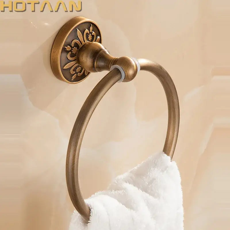 DecorBites antique brass round towel holder with ornate floral detailing on wall-mounted towel ring for classic bathrooms