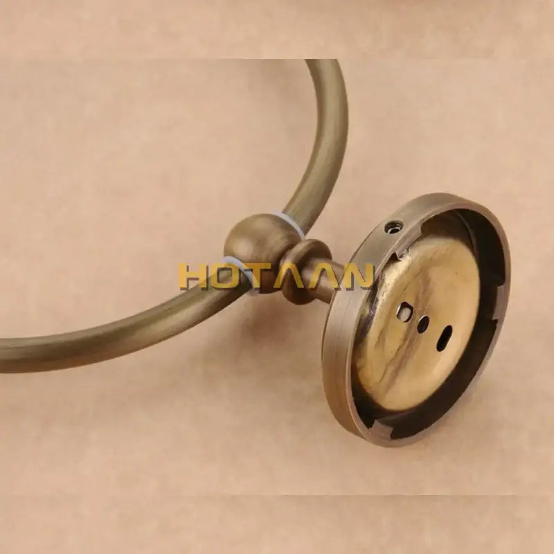 Decorbites antique brass wall-mounted towel ring holder with circular loop and decorative spherical joint