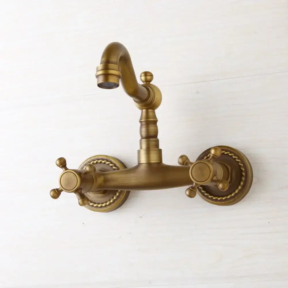 Decorbites antique brass wall mounted shower faucet with double handles and twisted rope detailing on circular base plates