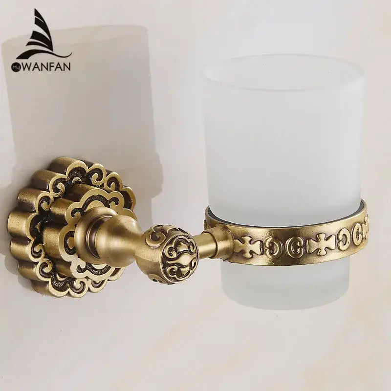 DecorBites antique brass wall mounted toothbrush holder with ornate scrollwork and frosted glass cup for bathroom decor