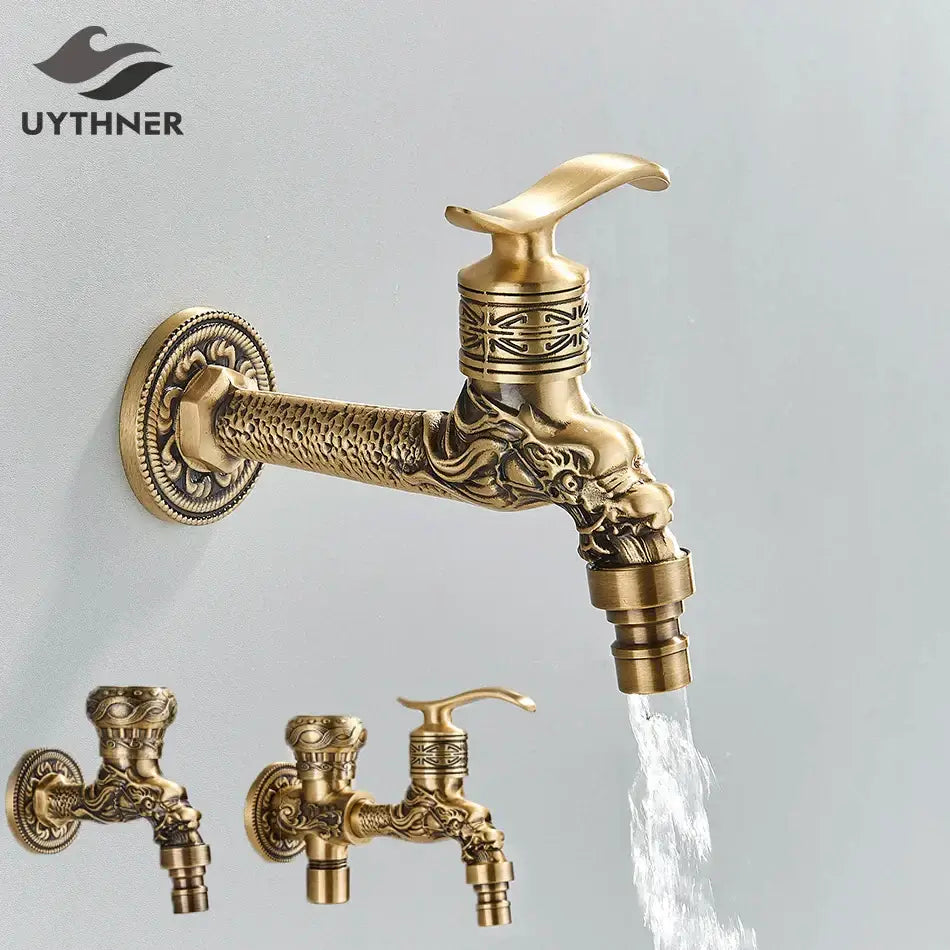 Antique brass wall mounted washing machine faucet with ornate dragon head design and intricate engraved patterns
