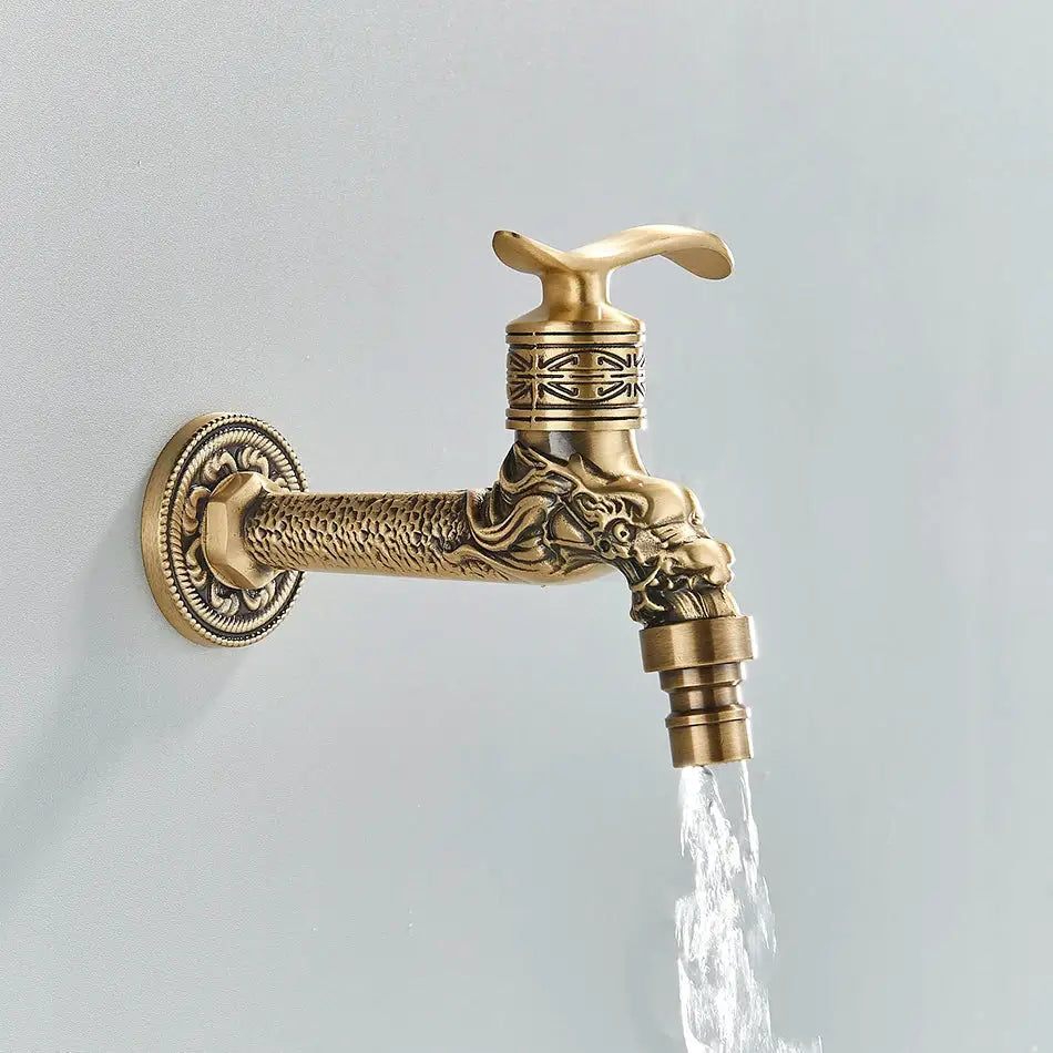 DecorBites™ antique brass wall mounted washing machine faucet with ornate dragon head design and intricate engraved patterns