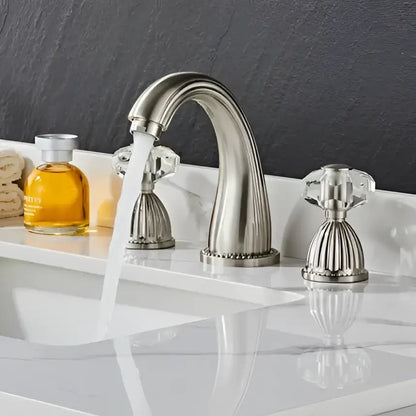 Stainless steel basin faucet with crystal knobs and curved spout in décorBites™ antique bronze 3 hole widespread basin design