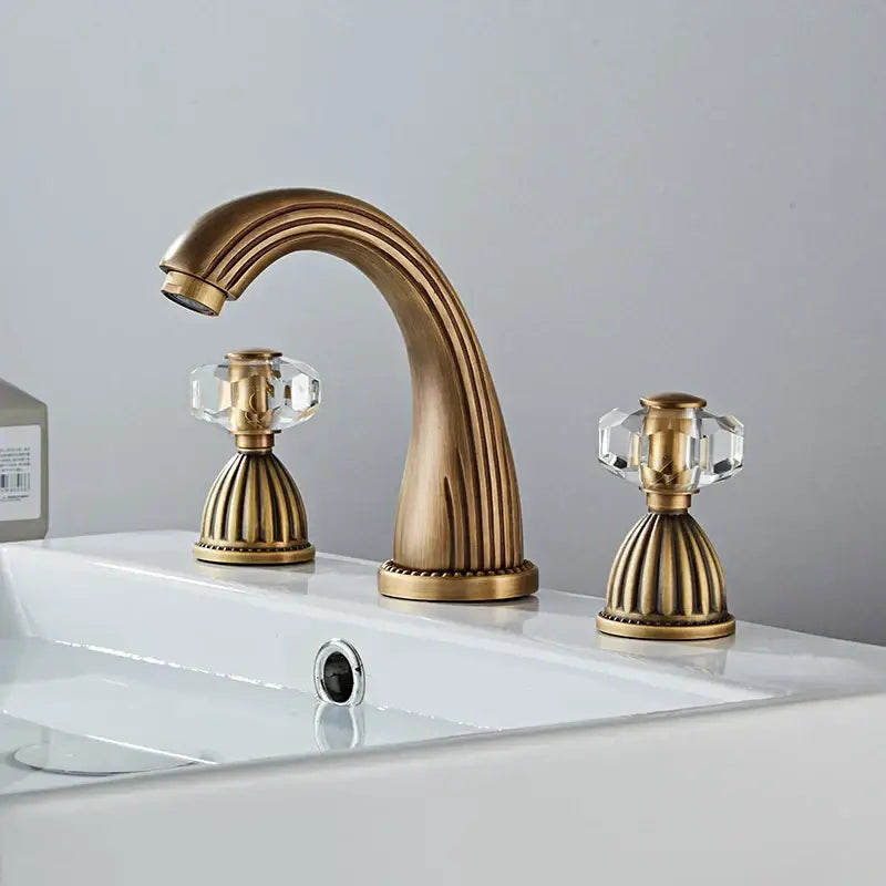 Decorbites antique bronze hole widespread basin faucet with three brass handles and crystal knob accents for bathroom use