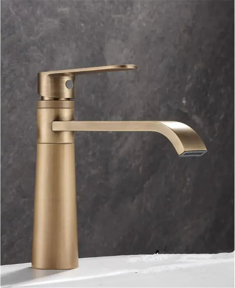 Modern brushed gold basin faucet with sleek minimalist design and curved spout from DecorBites antique bronze basin collection