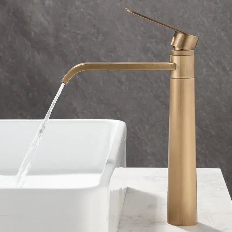 Modern brass-finished tall antique bronze basin faucet with sleek minimalist design for hot and cold water mixing
