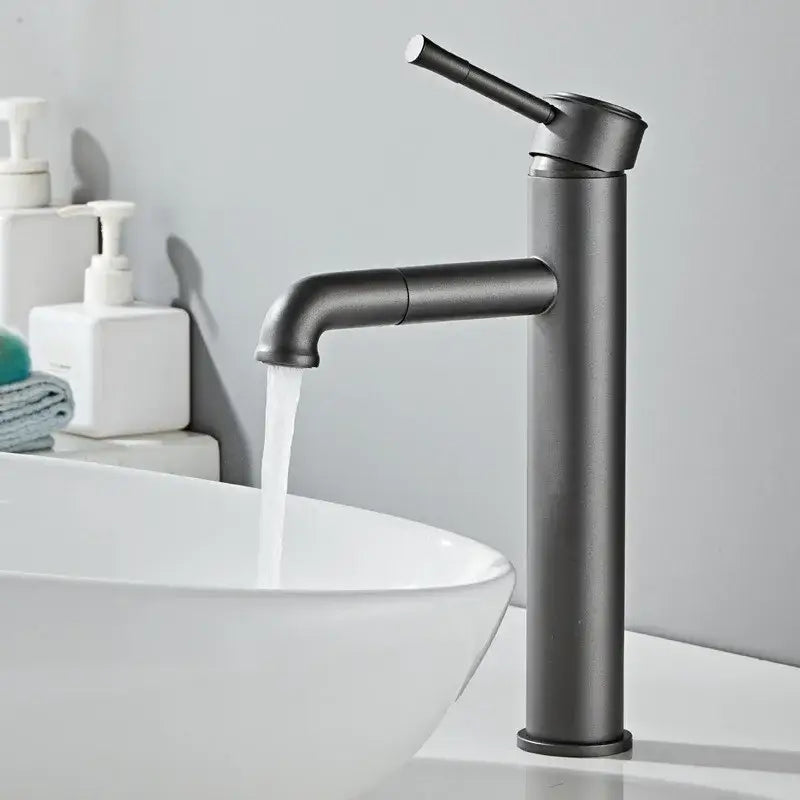 Modern matte black basin faucet with sleek tall design and curved spout, complementing antique bronze basin styles