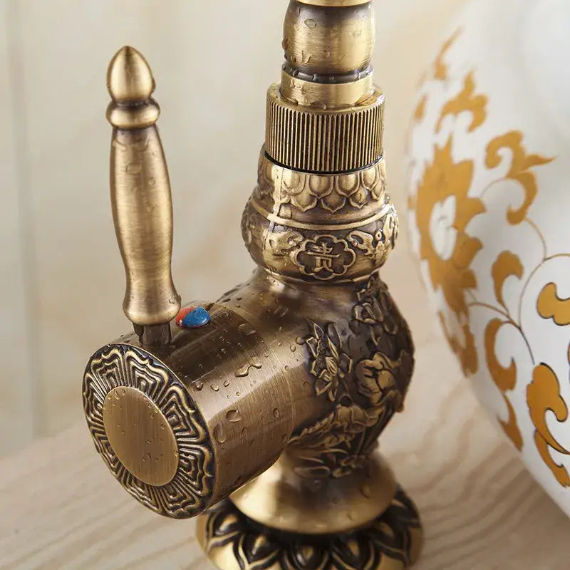DecorBites antique bronze basin faucet with intricate floral and lotus carvings single handle deck mounted mixer tap
