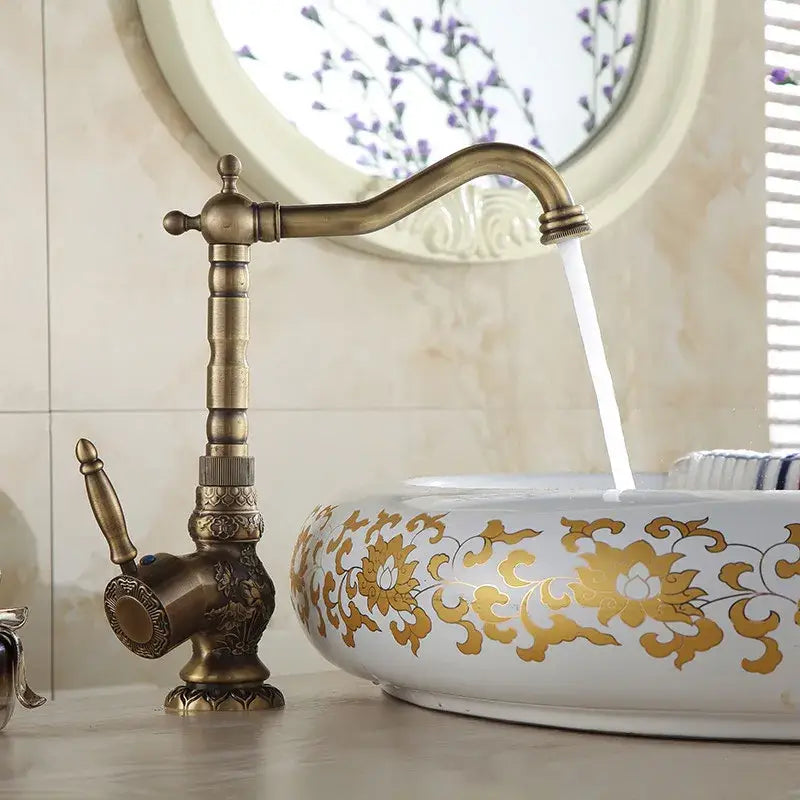 DecorBites antique bronze basin faucet with single handle deck mounted mixer tap in antique brass finish and ornate design